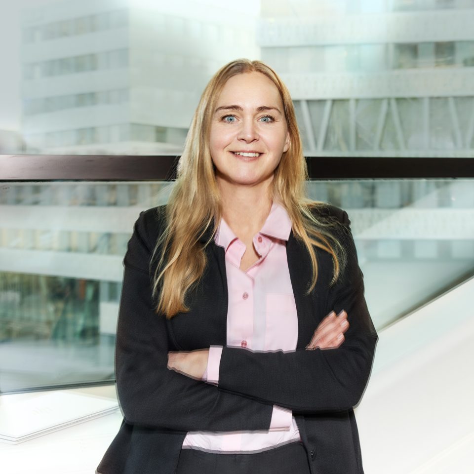 Anna Frylén founder & partner at Next Level Finance, a Newground company, standing in an indoor environment. Transforming finance functions for better decisions. Photo shot by Mattias Bardå at Norrmalmstorg.