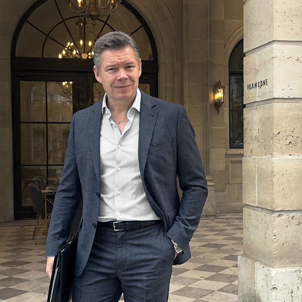 Göran Engwall, partner at Cidestra, a Newground Company, standing in an outdoor environment outside a building