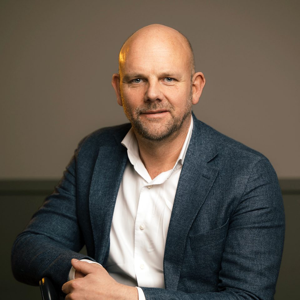 Jens Ölander, partner at Influence People, a Newground Company, sitting in an office environment