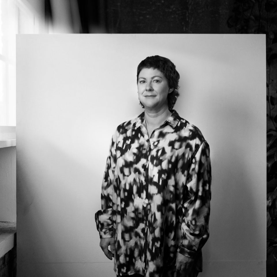 Caroline Raning, Partner at Influence, a Newground Company, standing in a portrait setting