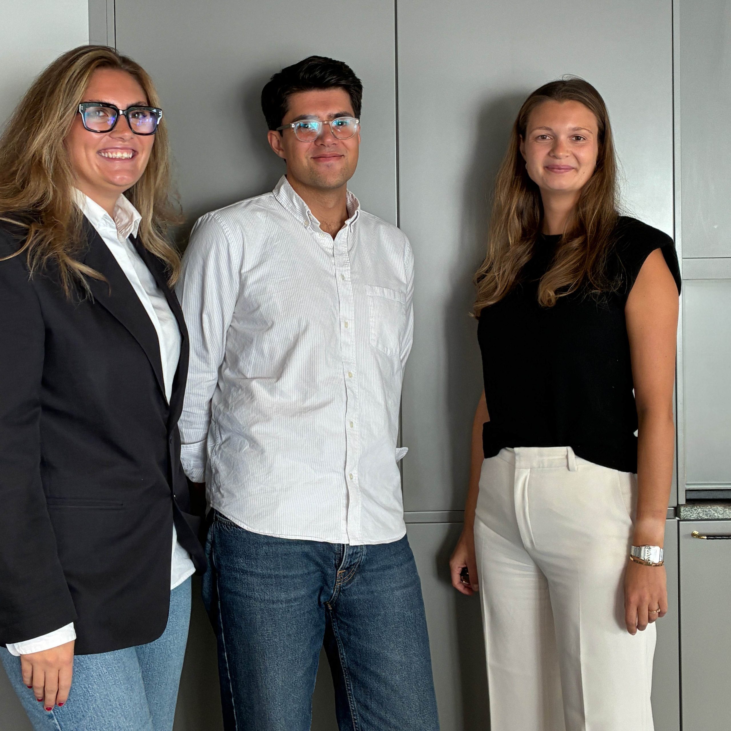 Fanny Jäger Röding of Influence People, Josef Gustafson of Adage and Sophia Jaconelli of PIR standing in an office setting.